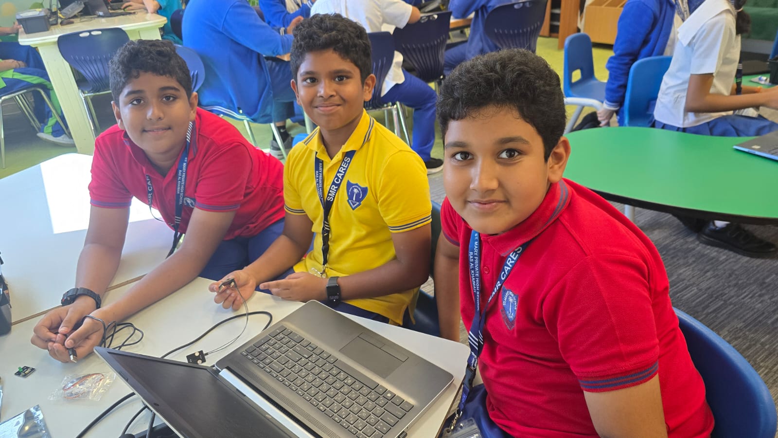 Students collaborating around a technology project